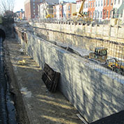 retaining wall located between the CSX Transportation railroad tracks and East 26th Street