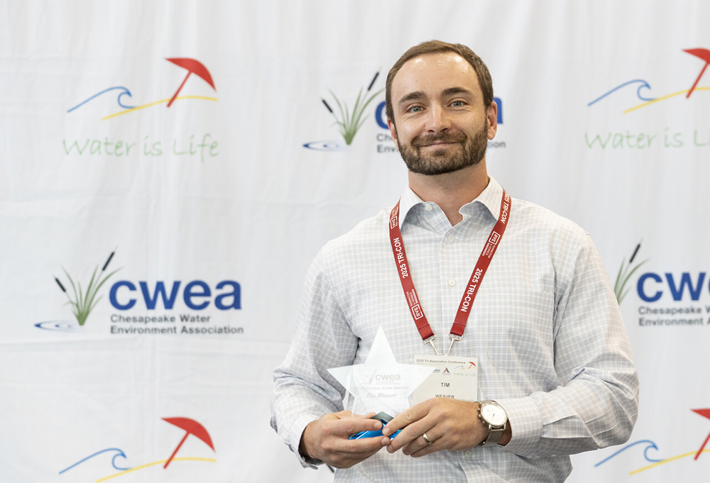 Tim Weaver holding award